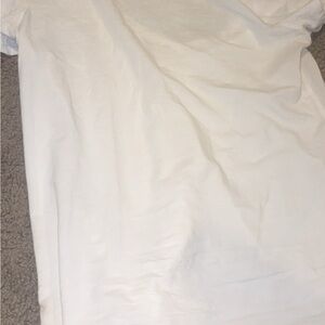 White LuLulemon V neck shirt. w/ tiny unnoticeable hole up top.